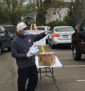 Bobby Valentine giving out masks