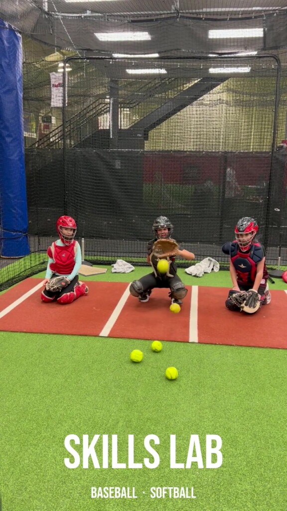 BVSA Skills Lab — three young catchers in full gear at indoor training facility