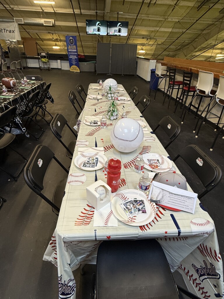 Baseball-themed birthday party table with custom place settings at BVSA